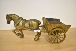 A heavy vintage brass horse and cart figurine.