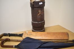 A 19th Century leather armorial cartridge canister with applied Royal Crest, holding cricket bat,