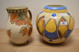 An Art Deco Chameleon Ware jardiniere, decorated in an African shield style design and measuring