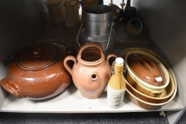 A stoneware ginger beer bottle manufactured by James Dunbar sold alongside a vintage milk churn, a