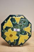 A late 19th Century octagonal shaped tile by Maw & Co., Benthall, the glazed design depicting yellow