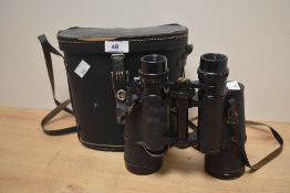 A pair of vintage Safari field binoculars, having a 7 x 50 magnification, with case