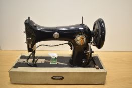 A Taylor Bird sewing machine with Carter electric motor, cased with foot pedal. Section of cable
