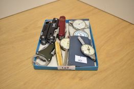 A small assortment of pocket knifes/multi-tools sold together with four vintage map measures.