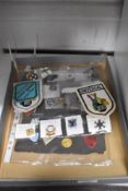 An assortment of badges and pins including Westminster Angling Society, Townswomen 1929-1979 and