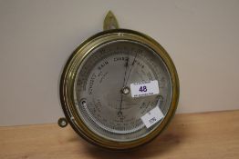 A Sewill of Liverpool ship's bulk head barometer, measuring 16cm in diameter