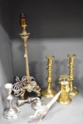 A French gilt metal table lamp base, raised on an ebonised triform base and measuring 48cm high, and