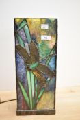 A Tiffany style glass table lamp, of rectangular form and decorated in a leaded dragon fly design,