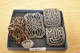 A small selection of cut steel including belt buckle, shoe buckles, button and chain