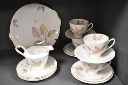 A Royal Standard tea set for four settings, decorated in a leaf design with pastel green trim, and