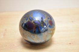 A John Ditchfield for Glasform iridescent petroleum glass paperweight, of spherical form and