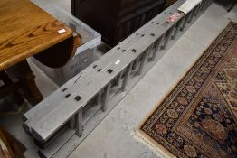 A set of aluminium three piece extending ladders