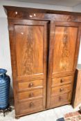 A Victorian mahogany wardrobe having faux draw doors, dimensions approx. Dimensions H206 W140cm