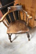 An early 20th Century smokers bow style office armchair