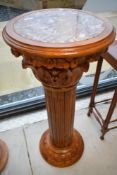 A modern wooden jardiniere stand having marble inset top, height approx. 92cm