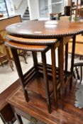 An early 20th Centiru mahogany nest of three tables , oval form, diameter approx. 58cm
