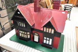 A vintage scratch built wooden dolls house