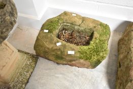 A small sandstone trough