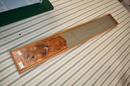 A modern Elm art mirror, with label for High Head Sculpture Valley, 2006, approx. 93 x 14cm