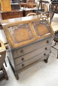 A traditional dark stained bureau