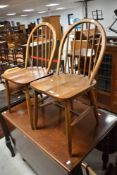A pair of vintage Ercol (290) hoop and stick back kitchen chairs