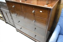 An early 20th Century mahogany bedroom chest of two over three drawers, having ledge back, width