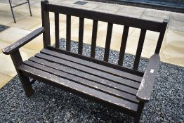 A wooden garden bench , width approx 122cm