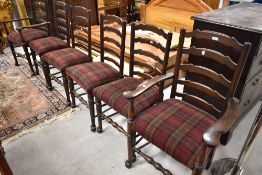 A set of six (four plus two) ladder back dining chairs upholstered in red tweed upholstery