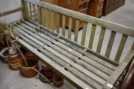 A wooden garden bench , having slatted seat , length approx. 183cm