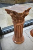 A resin moulded jardiniere stand, of column form, height approx. 86cm