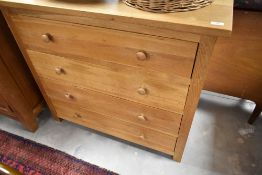 A modern golden oak four drawer chest, width approx. 99cm