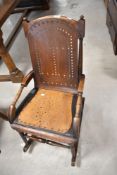 A 19th Century mahogany rocking chair having pierced ply seat and back