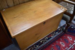 A traditional stripped pine bedding box, approx. Width 85cm, depth 53cm, height 48cm