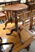 A 19th Century mahogany occasional pedestal table having circular top, turned column and triple