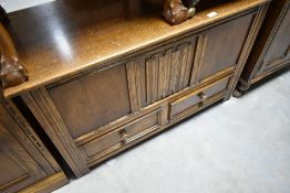 A vintage oak bedding chest having linen fold decoration to front panel, width approx. 99cm