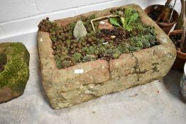 A large sandstone trough