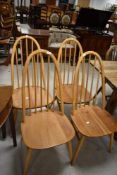 A set of four light Ercol hoop and stick back dining chairs, Gold Label Windsor (365)
