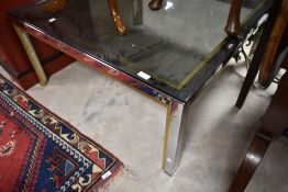 A chrome and smoked glass coffee table approx. 91 x 91cm