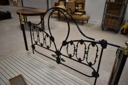 A Victorian cast and brass double bed frame and base