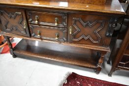 An early 20th Century oak jacobean style sideboard, width approx. 153cm