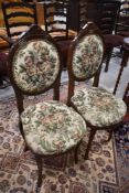 A pair of reproduction upholstered hall chairs