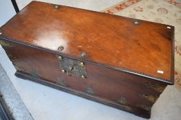 A large 19th century brass bound and handled mahogany/teak maritime/seafarers' chest with ornate