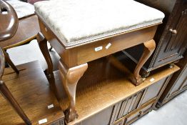 An early 20th Century mahogany Queen Anne style piano stool