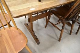 A traditional oak refectory style dining table, approx. 145 x 75cm