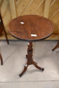 A 19th Century mahogany pedestal occasional table having circular top , turned column and trefoil