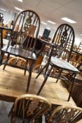 A set of six (four plus two) wheelback dining chairs