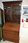 A very nice quality Antique Georgian style mahogany bureau bookcase having astral glazed top and
