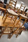 A traditional oak craftsman made Arts and Crafts style refectory style table with drop leaves to