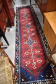 A traditional carpet runner, approx 310 x 74cm