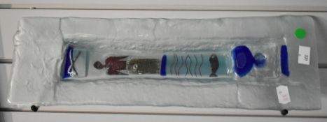 A pair of modern and attractive glazed terracotta wall mounted tiles, each with clear glass surround